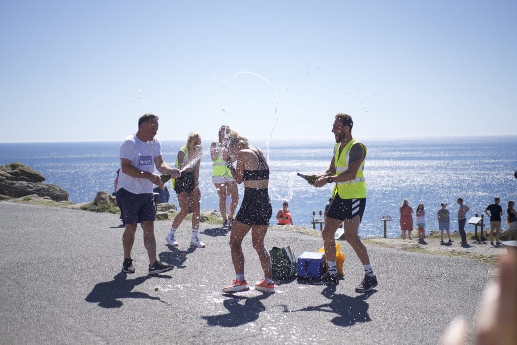 2. Imo Boddy Centre With Dad Julian Left And Support Chris Taylor Right At Lands End. Credit Tom Leeming 