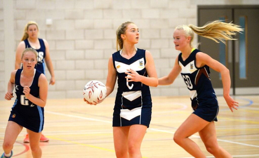 Olivia playing netball for Sedbergh School